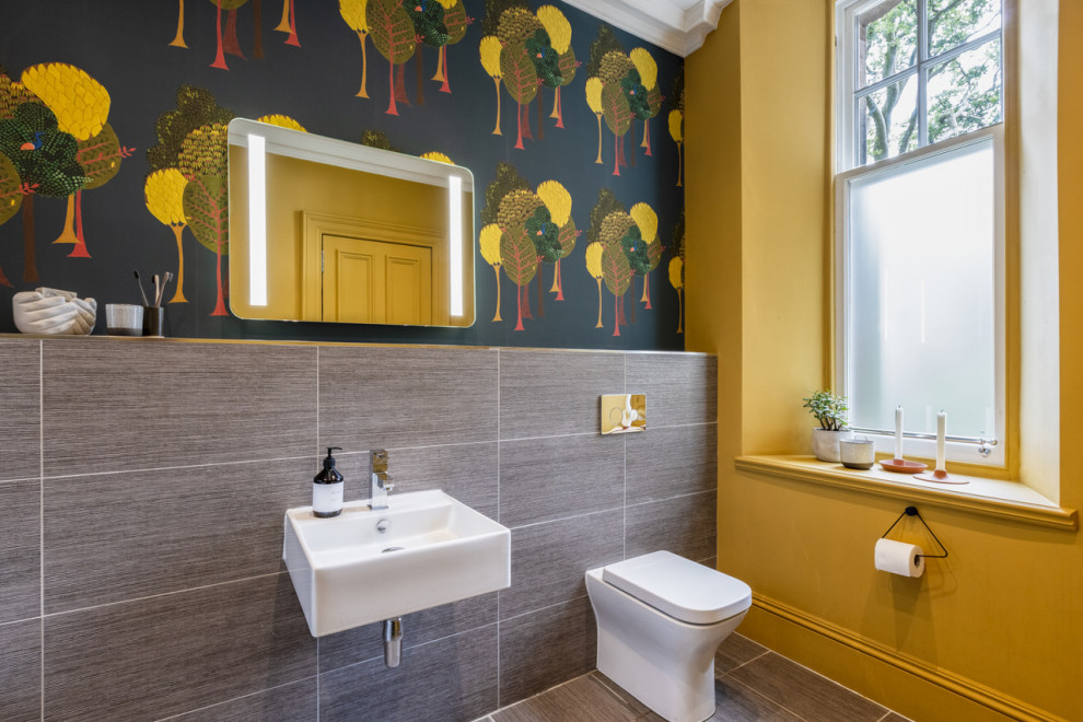Photo of a medium sized contemporary family bathroom in Glasgow with a single sink and wallpapered walls.