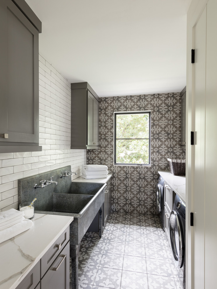 Inspiration for a country galley dedicated laundry room in Denver with an utility sink, shaker cabinets, grey cabinets, a side-by-side washer and dryer, multi-coloured floor, white benchtop and grey walls.