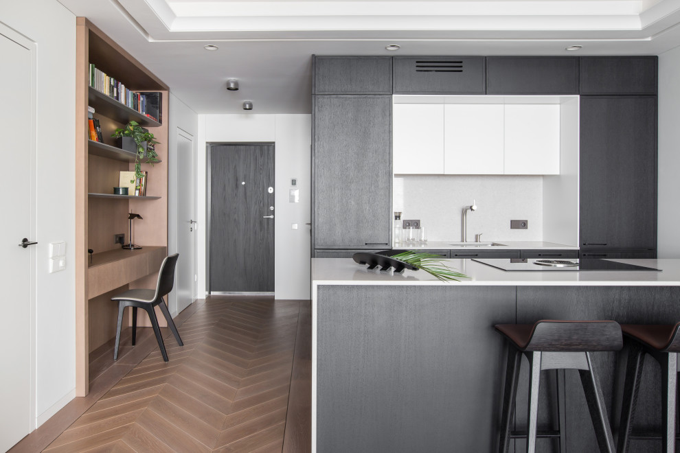 Inspiration for a contemporary kitchen in London with light hardwood floors and pink floor.