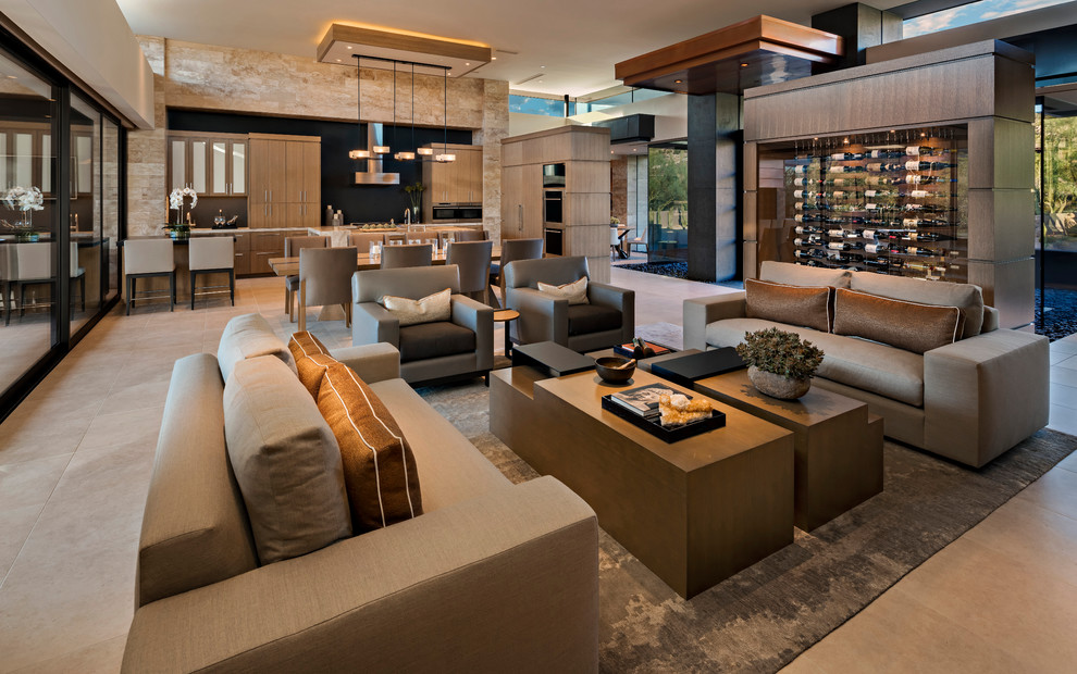 This is an example of a contemporary formal open concept living room in Phoenix with beige walls and beige floor.