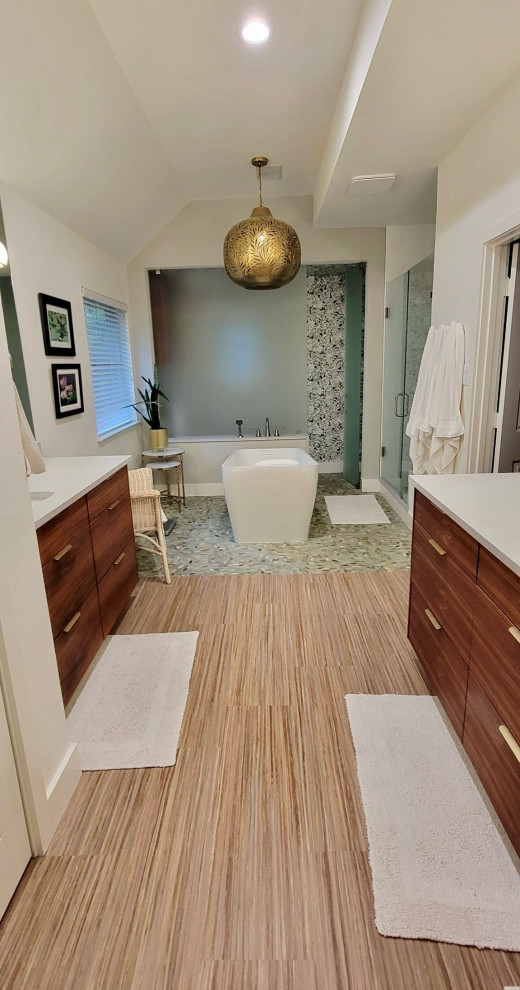 Home remodel is complete in PLANO. Updated and expanded the master bath with a toilet closet behind etched glass, pedestal tub, walk-in shower, custom wood vanity, wallpaper and custom flooring.