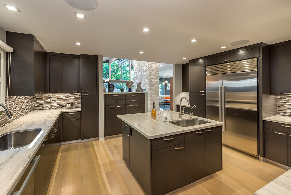 Design ideas for a large midcentury u-shaped separate kitchen in San Francisco with dark wood cabinets, multi-coloured splashback, with island, an undermount sink, flat-panel cabinets, mosaic tile splashback, light hardwood floors, quartzite benchtops and stainless steel appliances.