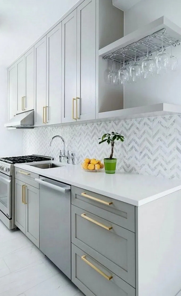 Design ideas for a mid-sized contemporary single-wall eat-in kitchen in Columbus with an undermount sink, recessed-panel cabinets, grey cabinets, quartz benchtops, white splashback, stone tile splashback, stainless steel appliances, ceramic floors, white floor and white benchtop.