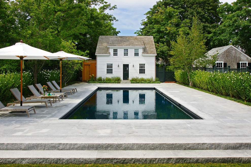 Photo of a traditional backyard rectangular pool in Boston.