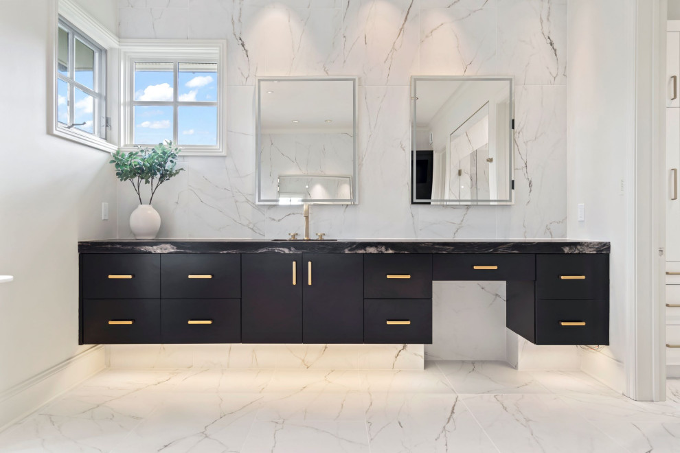 Large modern master bathroom in Kansas City with flat-panel cabinets, black cabinets, a claw-foot tub, marble, marble floors, an undermount sink, granite benchtops, a hinged shower door, black benchtops, a niche, a single vanity and a floating vanity.