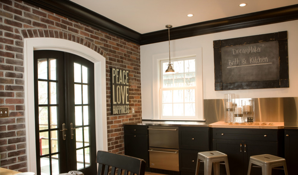 Kitchen - large transitional l-shaped dark wood floor kitchen idea with an undermount sink, recessed-panel cabinets, dark wood cabinets, stainless steel appliances and an island
