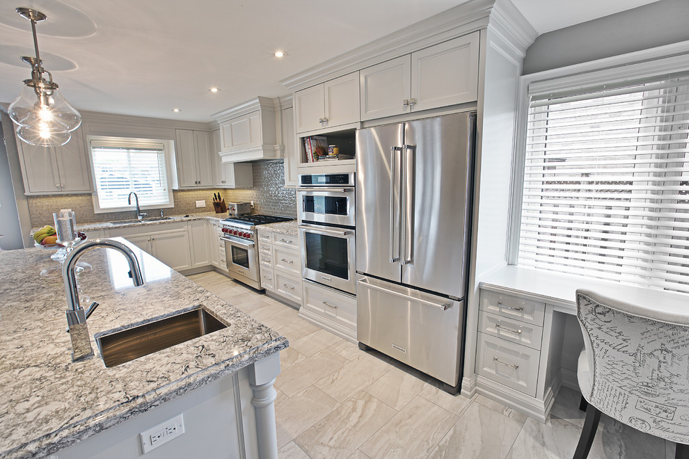 This is an example of a mid-sized transitional l-shaped eat-in kitchen in Toronto with an undermount sink, shaker cabinets, white cabinets, quartzite benchtops, grey splashback, glass tile splashback, stainless steel appliances, porcelain floors and with island.