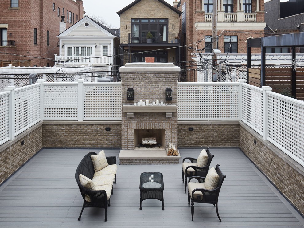Design ideas for a large transitional rooftop deck in Chicago with a fire feature and no cover.