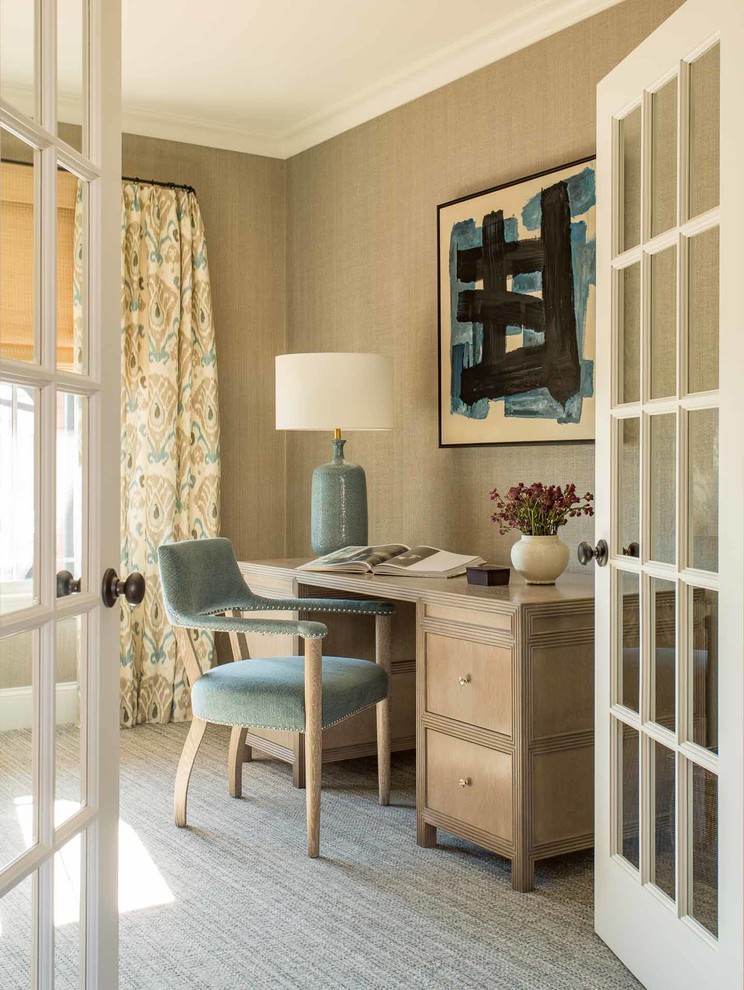 Inspiration for a transitional study room in Los Angeles with beige walls, carpet and a freestanding desk.