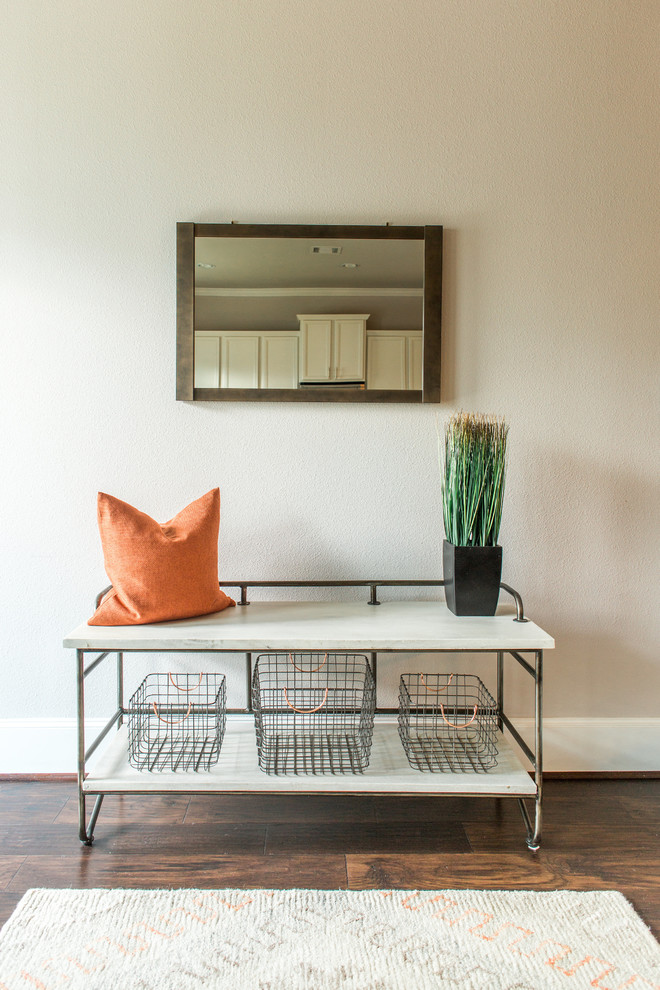 Example of a small transitional dark wood floor entry hall design in Houston with beige walls