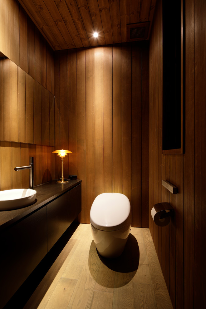 Contemporary powder room in Other.