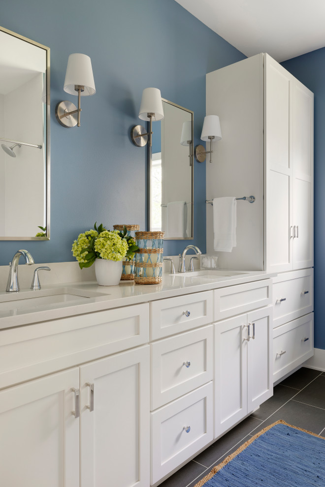 Inspiration for a mid-sized traditional bathroom in Minneapolis with shaker cabinets, white cabinets, an alcove shower, blue walls, porcelain floors, an undermount sink, engineered quartz benchtops, grey floor, a hinged shower door, grey benchtops, a double vanity and a built-in vanity.
