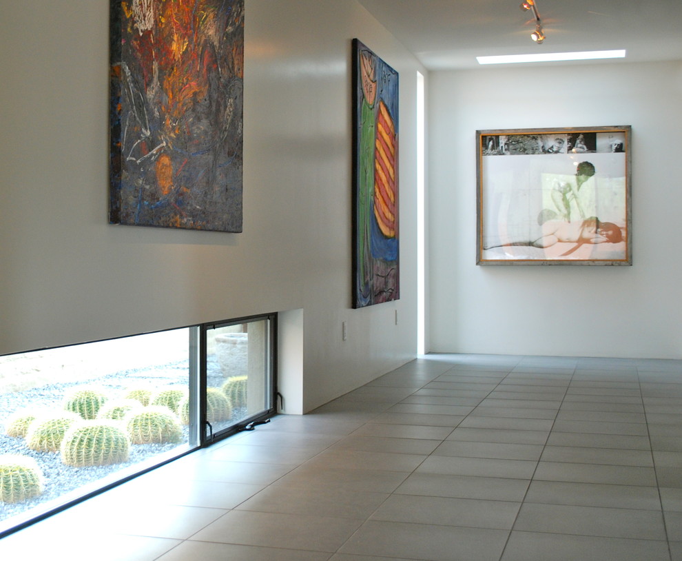 Photo of a contemporary hallway in Phoenix with white walls and ceramic floors.