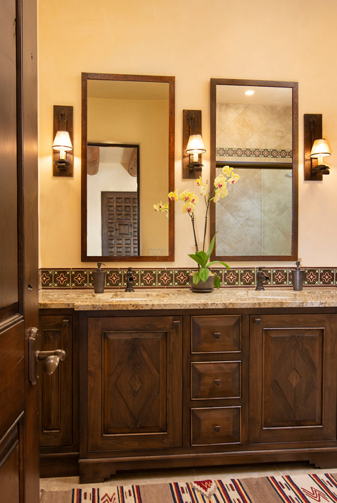 Design ideas for a bathroom in Albuquerque with brown cabinets, brown tile, beige walls, brown benchtops and a double vanity.