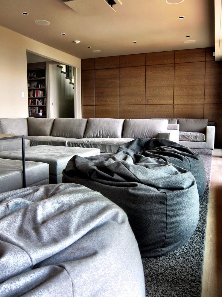 Photo of a contemporary home theatre in Vancouver.