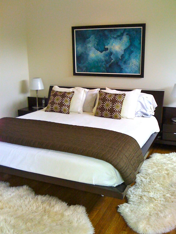 Contemporary bedroom in Atlanta with beige walls.