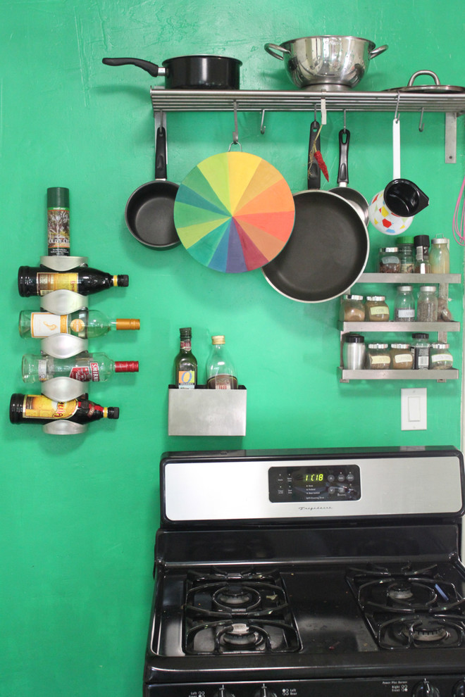 Photo of an eclectic kitchen in Los Angeles with black appliances.