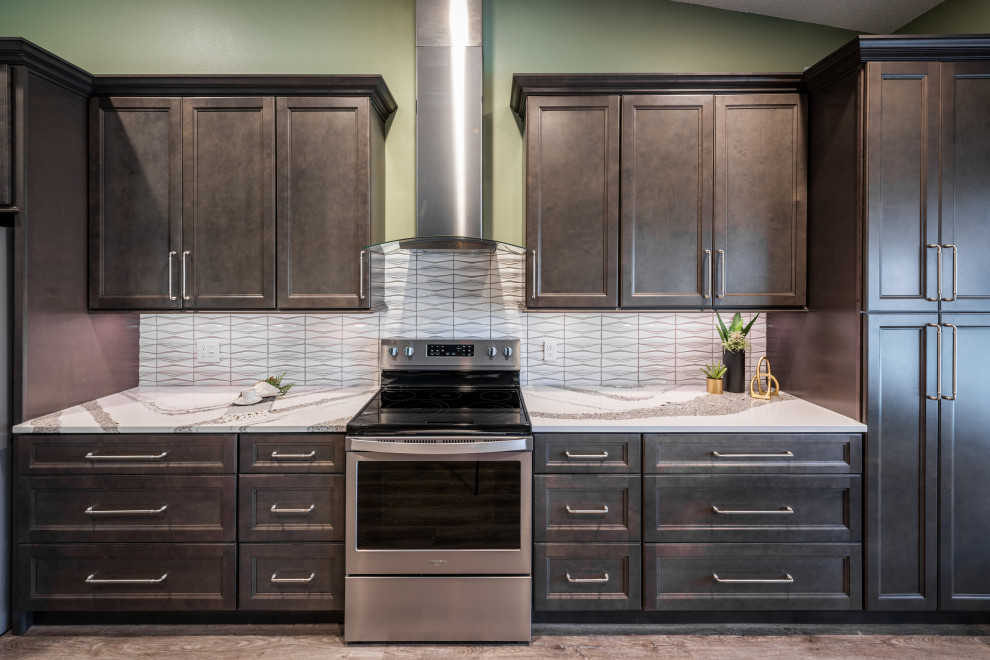 Inspiration for a huge transitional single-wall vinyl floor and gray floor eat-in kitchen remodel in Orlando with an undermount sink, recessed-panel cabinets, gray cabinets, quartz countertops, white backsplash, porcelain backsplash, stainless steel appliances, an island and white countertops