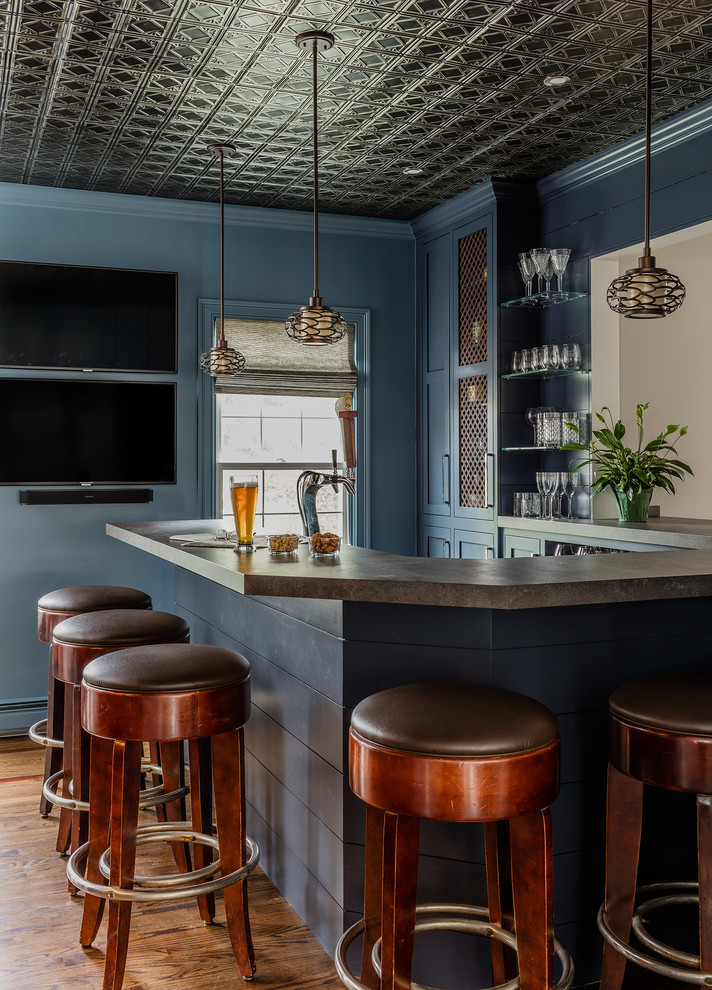Design ideas for a transitional home bar in Boston.