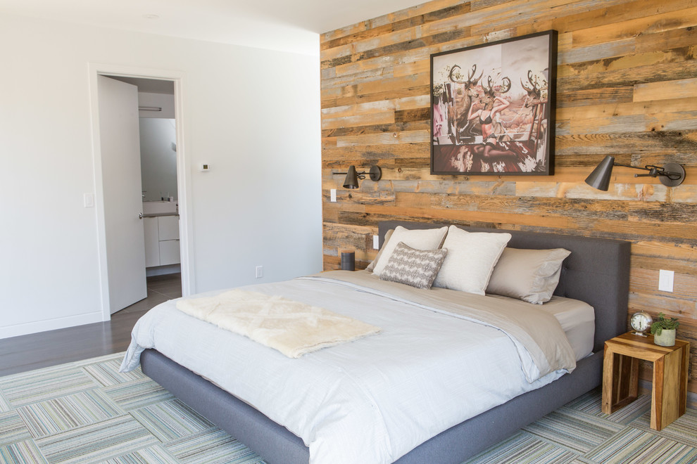Contemporary bedroom in Denver with white walls and dark hardwood floors.
