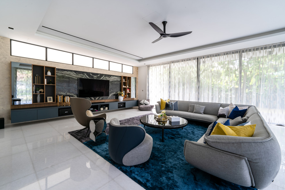 Contemporary open concept living room in Singapore with beige walls, a built-in media wall, white floor and recessed.