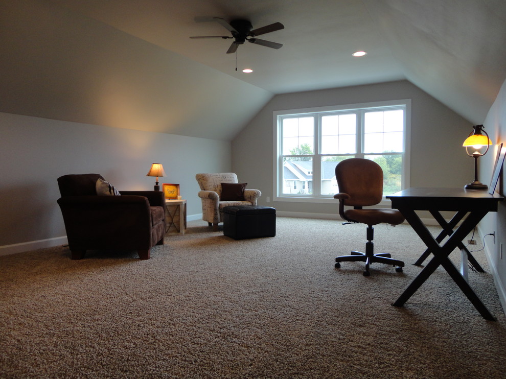 Photo of a mid-sized traditional open concept family room in Milwaukee with a game room, grey walls and carpet.