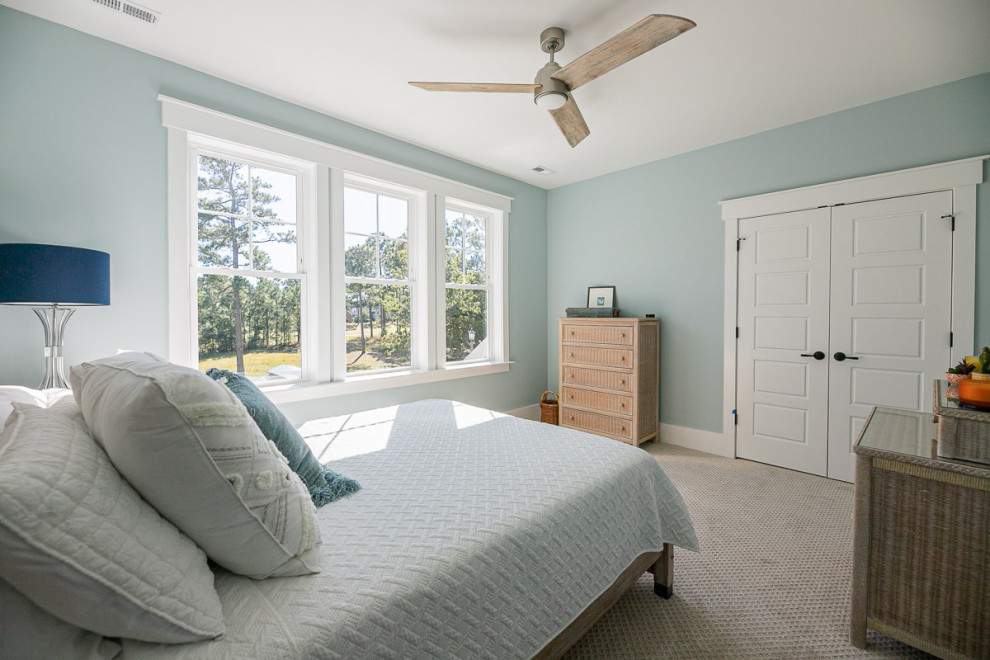 Example of a mid-sized beach style bedroom design in Other