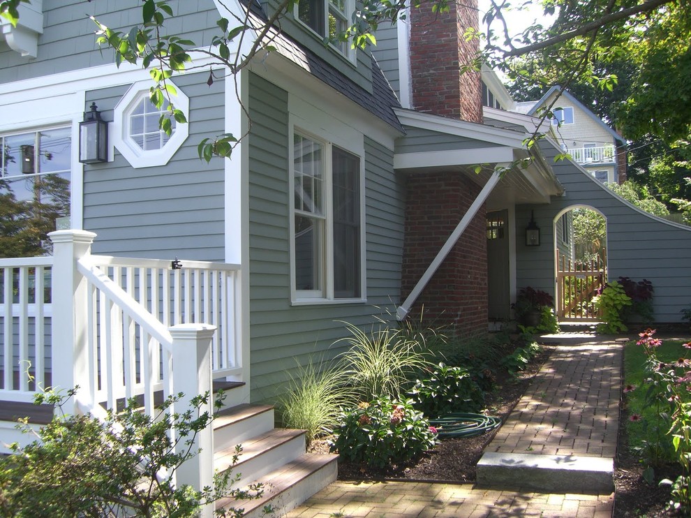 This is an example of a beach style exterior in Boston with wood siding.