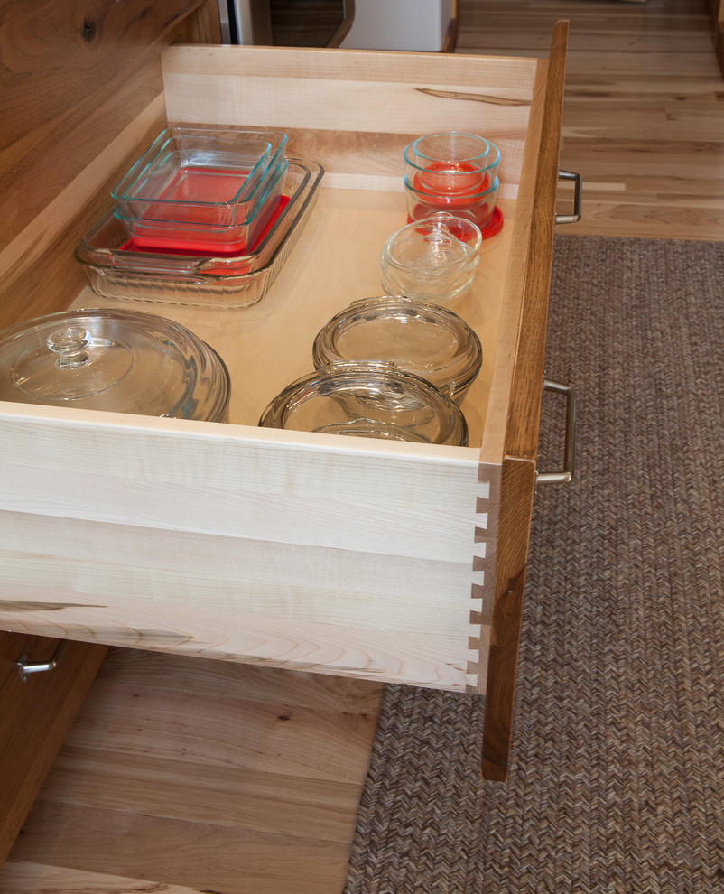 Inspiration for a rustic kitchen remodel in Indianapolis with flat-panel cabinets and medium tone wood cabinets