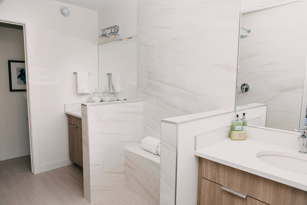 Design ideas for a mid-sized modern wet room bathroom in Edmonton with shaker cabinets, medium wood cabinets, a one-piece toilet, white tile, white walls, an undermount sink, white floor, an open shower and white benchtops.