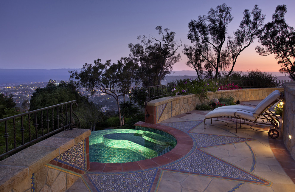 Mediterranean pool in Santa Barbara with a hot tub.