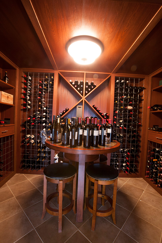 Inspiration for a large contemporary wine cellar in New York with storage racks and ceramic floors.