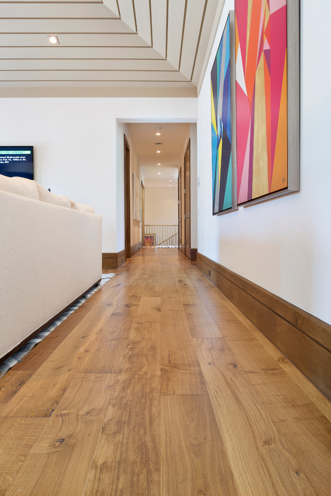 Example of a mid-sized transitional bamboo floor home design design in Miami with white walls