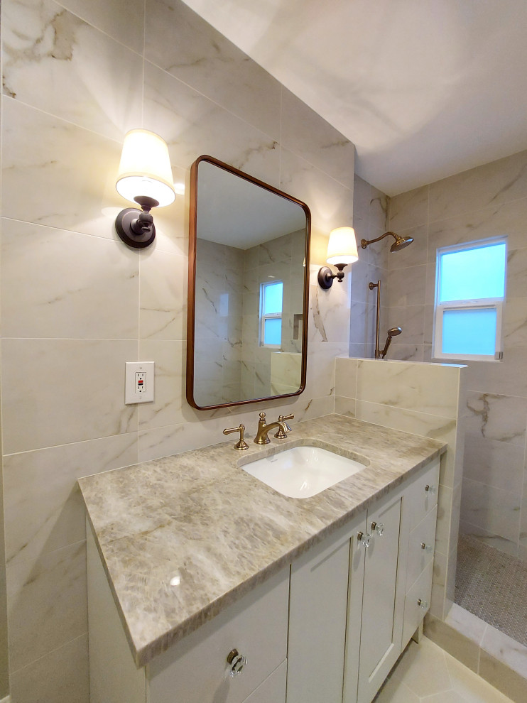 This is an example of a large traditional ensuite bathroom in Portland with shaker cabinets, white cabinets, a walk-in shower, a two-piece toilet, multi-coloured tiles, porcelain tiles, grey walls, porcelain flooring, a submerged sink, granite worktops, white floors, an open shower, brown worktops, a wall niche, a single sink and a built in vanity unit.