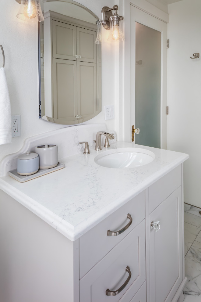 Small master bathroom in Other with furniture-like cabinets, grey cabinets, a one-piece toilet, blue tile, glass tile, white walls, porcelain floors, an undermount sink, engineered quartz benchtops, white floor, a hinged shower door, white benchtops, a shower seat, a single vanity and a built-in vanity.