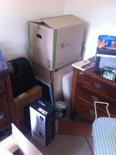 Decluttered reception room used as a storage room