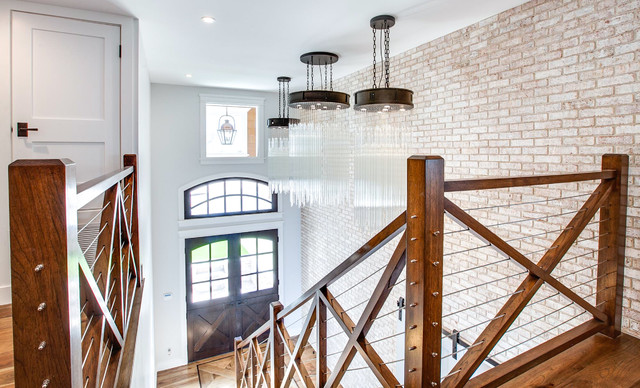 Brick Accent Wall / Light Fixtures beach-style-entry