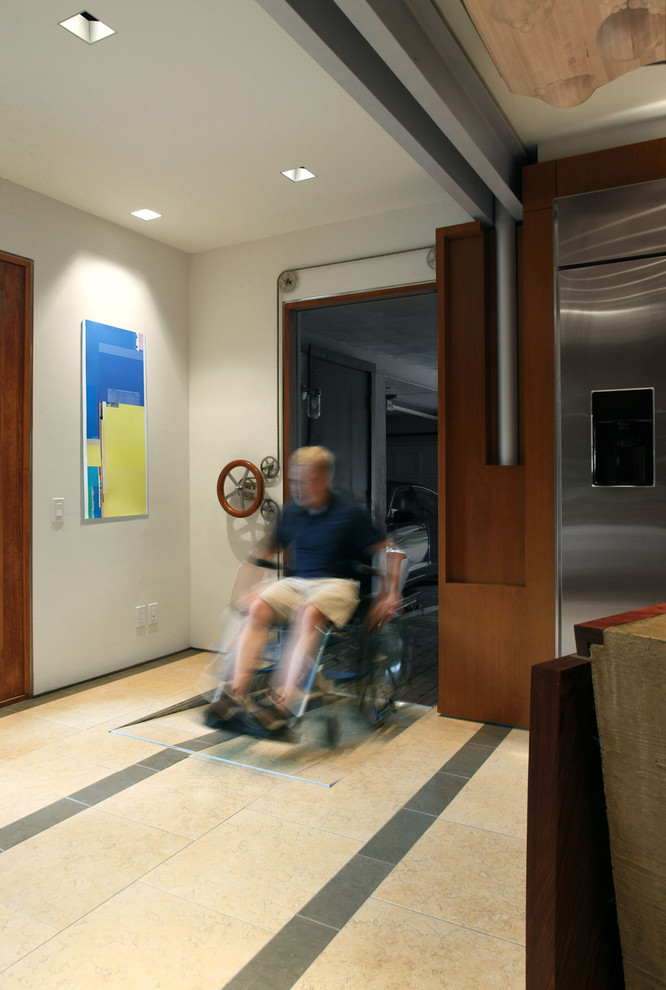 This is an example of a contemporary hallway in Omaha with white walls.