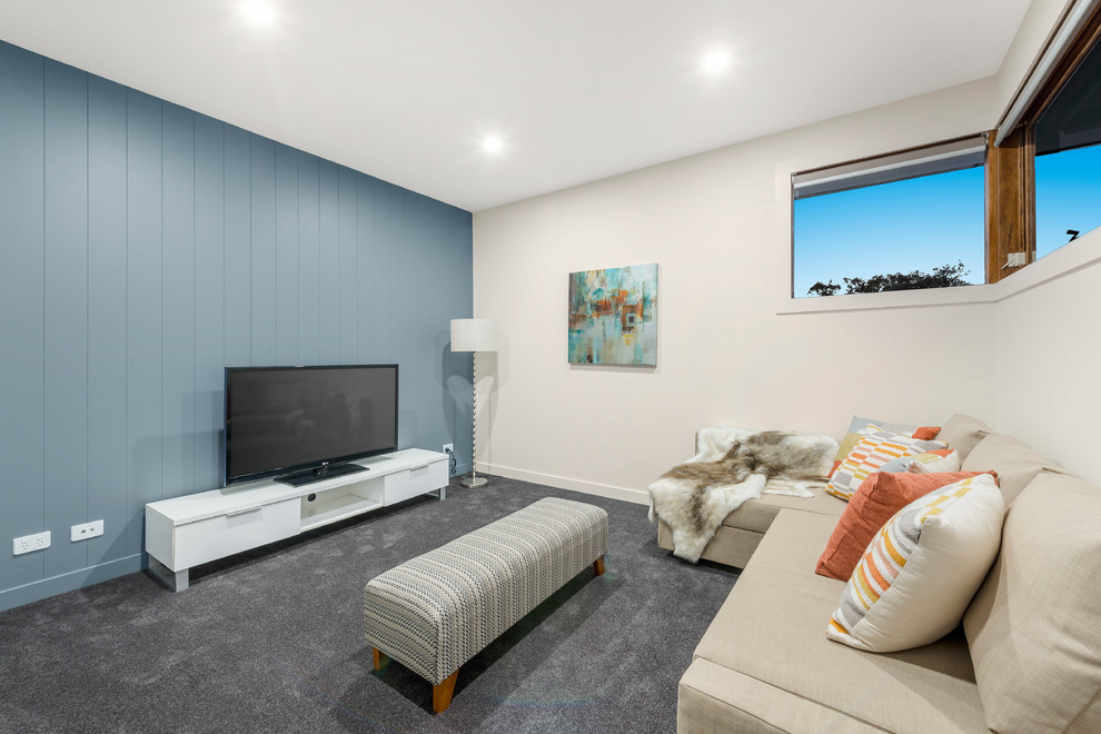 Photo of a mid-sized contemporary enclosed family room in Melbourne with a freestanding tv.