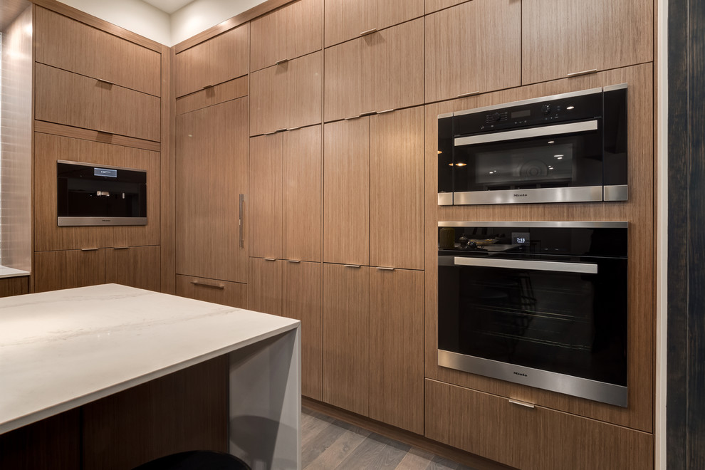 Example of a transitional kitchen design in Calgary