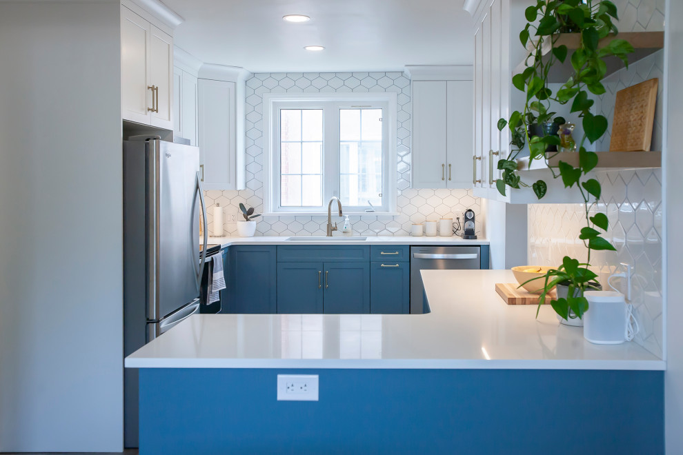 Eat-in kitchen - mid-sized transitional l-shaped eat-in kitchen idea with an undermount sink, blue cabinets, quartz countertops, white backsplash, porcelain backsplash, stainless steel appliances, no island and white countertops