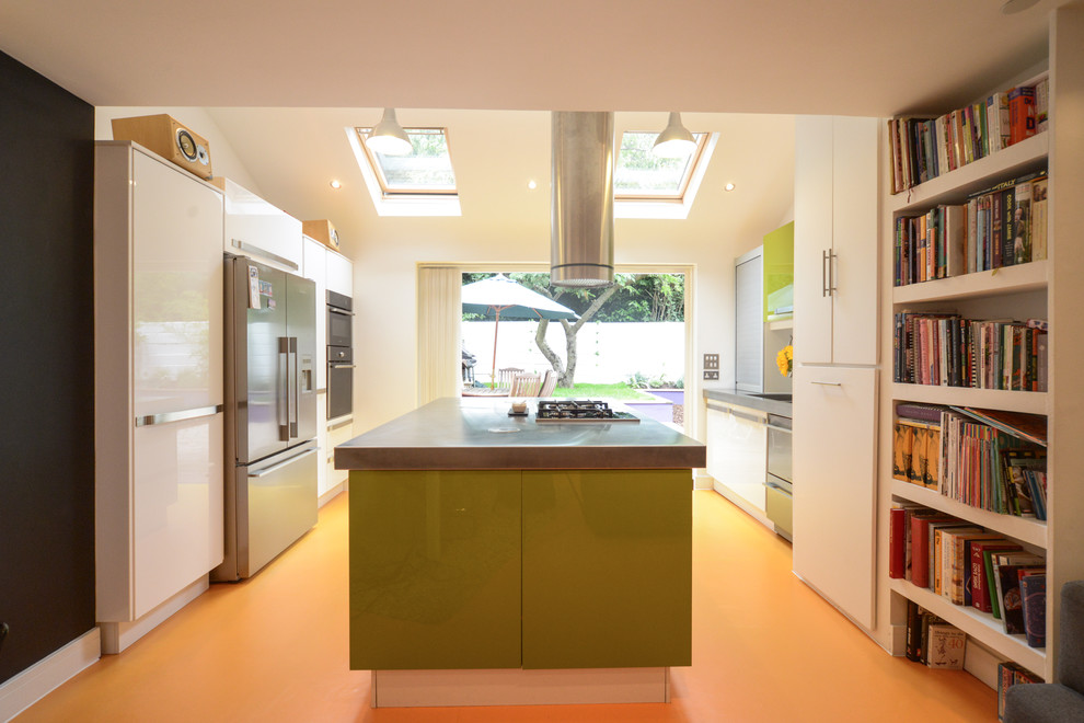 Inspiration for a mid-sized contemporary open plan kitchen in London with a drop-in sink, flat-panel cabinets, green cabinets, stainless steel benchtops, porcelain splashback, panelled appliances, vinyl floors, with island and orange floor.