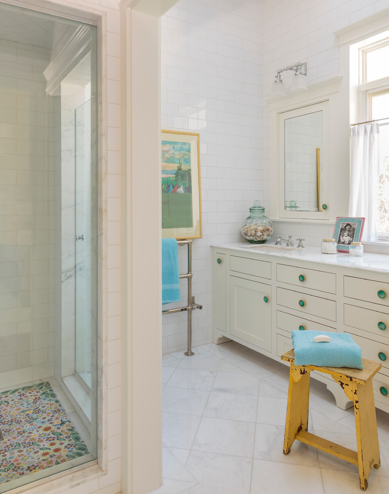 Design ideas for a large traditional master bathroom in Los Angeles with shaker cabinets, white cabinets, marble benchtops, white tile, subway tile, an undermount sink, a corner shower, marble floors and white floor.