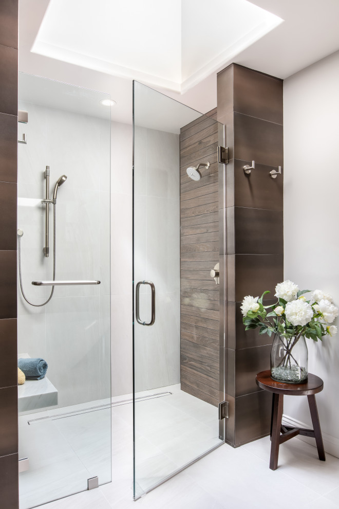 Example of a mid-sized minimalist master brown tile and wood-look tile ceramic tile, white floor and double-sink bathroom design in San Diego with shaker cabinets, brown cabinets, white walls, an integrated sink, quartz countertops, a hinged shower door, beige countertops and a built-in vanity