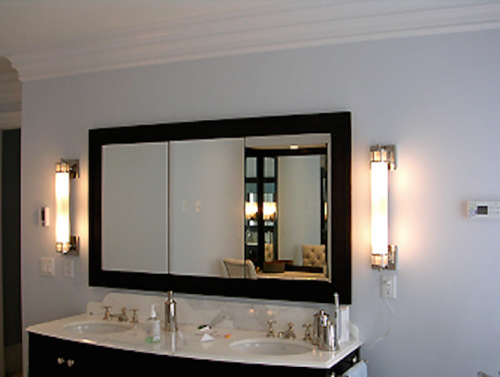 Transitional bathroom photo in Boston with a drop-in sink, dark wood cabinets, solid surface countertops and blue walls