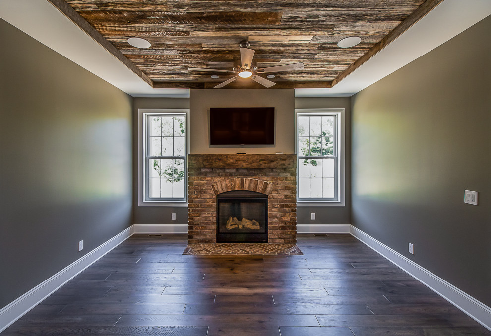 Photo of a large rustic open plan living room in Cleveland with green walls, medium hardwood flooring, a standard fireplace, a brick fireplace surround, a wall mounted tv, brown floors, a wood ceiling and all types of wall treatment.