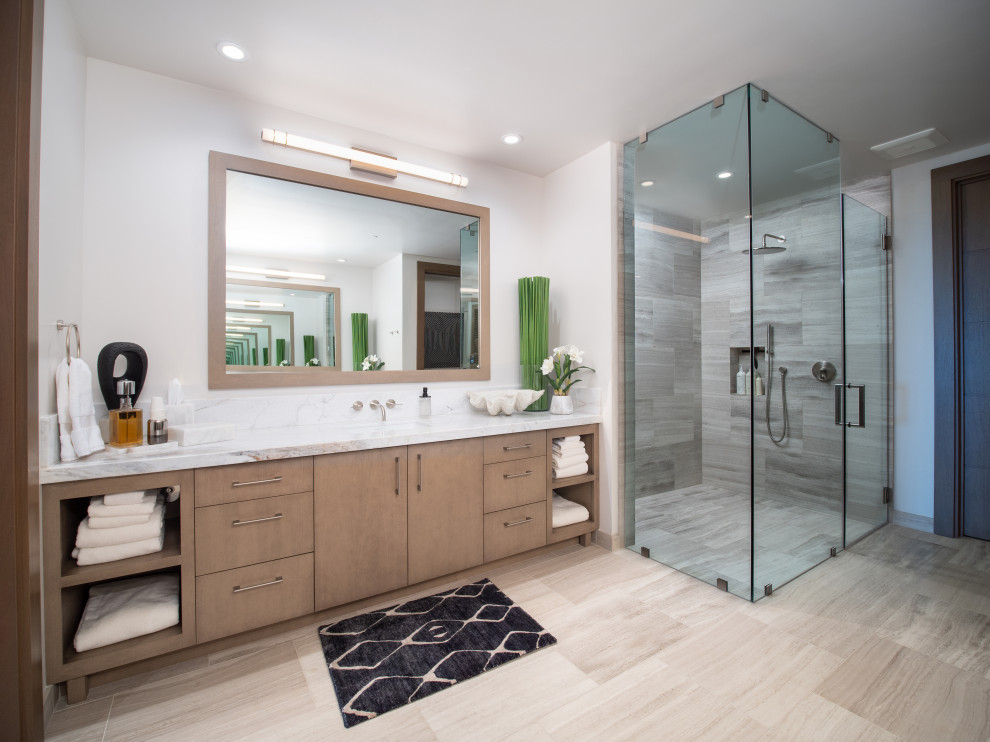 Design ideas for a large contemporary master bathroom in Hawaii with flat-panel cabinets, medium wood cabinets, a curbless shower, white walls, travertine floors, an undermount sink, granite benchtops, beige floor, a hinged shower door, white benchtops, a single vanity and a built-in vanity.