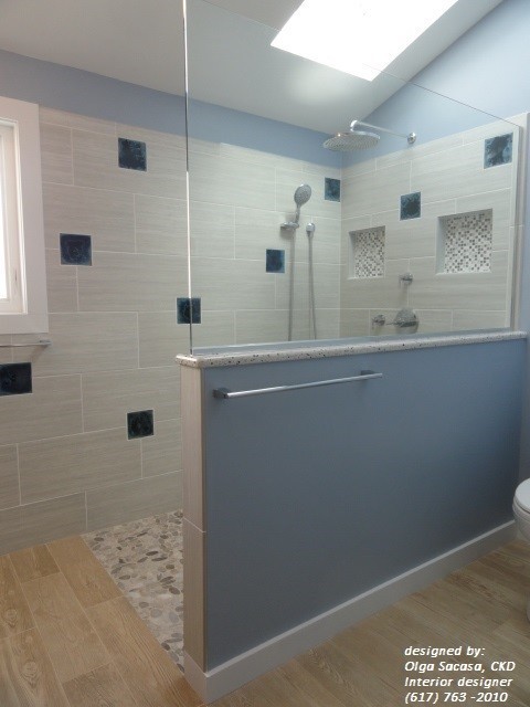 Mid-sized trendy brown tile and wood-look tile porcelain tile walk-in shower photo in Boston with a vessel sink, glass-front cabinets, dark wood cabinets, quartzite countertops, a one-piece toilet and blue walls