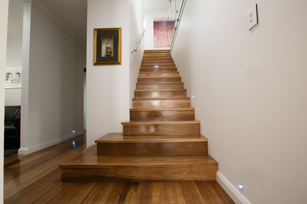 Design ideas for a contemporary wood straight staircase in Sydney with wood risers.
