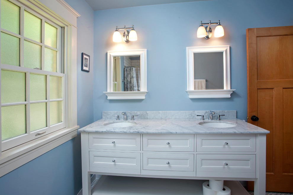 Inspiration for a small traditional master bathroom in Minneapolis with an undermount sink, furniture-like cabinets, white cabinets, marble benchtops, an alcove tub, a shower/bathtub combo, white tile, mosaic tile, blue walls and marble floors.